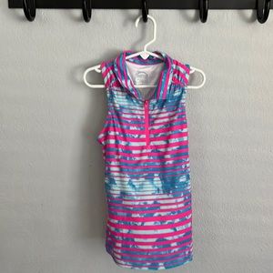 A gently used sleeveless girls golf shirt!